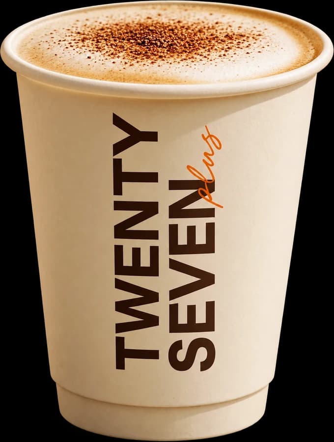 A cappuccino dusted with cocoa in a Twenty Seven Plus paper cup